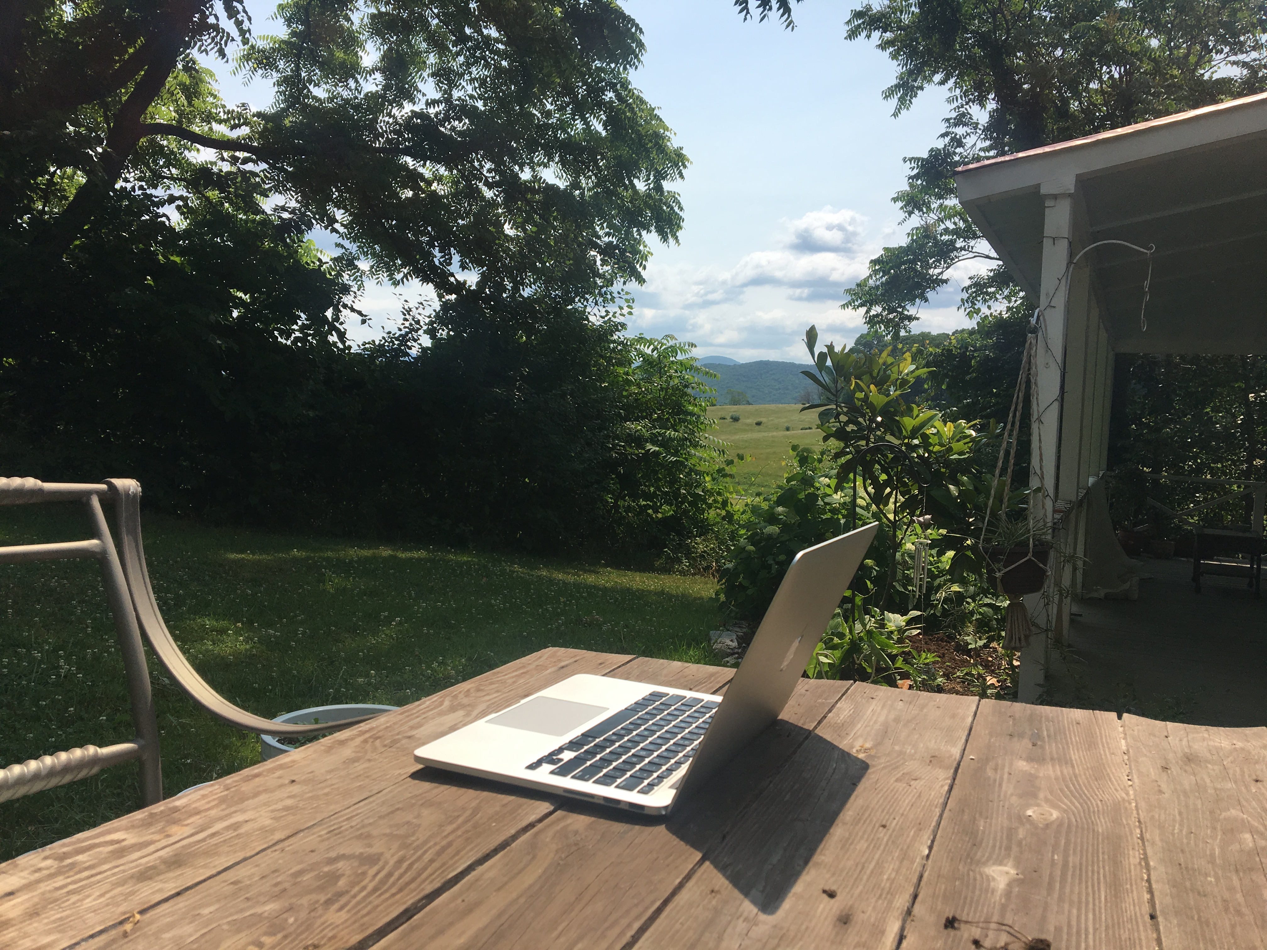 laptop on table in outdoor setting